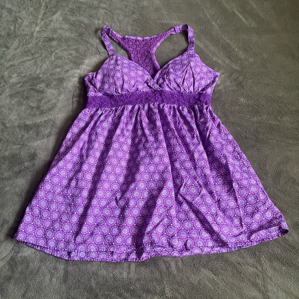 Purple babydoll top with white floral pattern